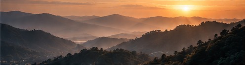 Warm light over layered mountain ranges